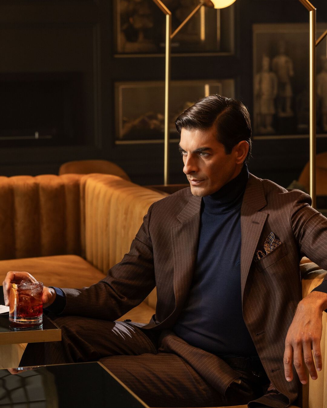 the model having a glass of Stefano Ricci cocktail