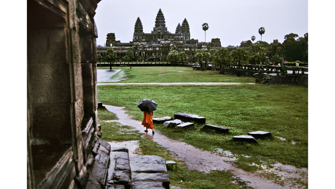 Buddhist Monk Walks in the Rain. Angkor Wat, Cambodia, 1998