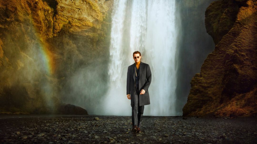 model in front of the waterfall in Iceland