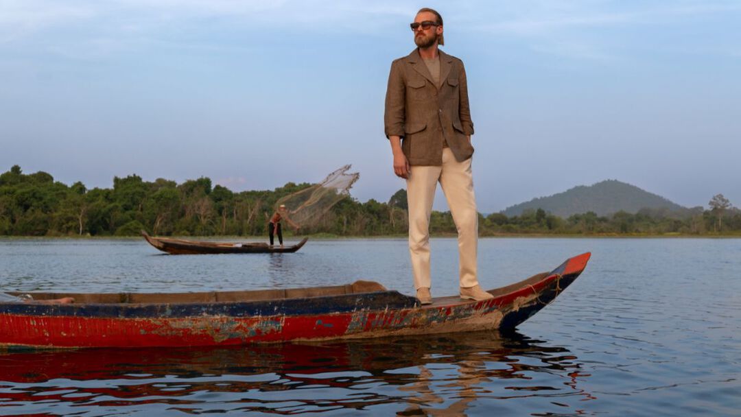 the model on a boat in Cambodian lake