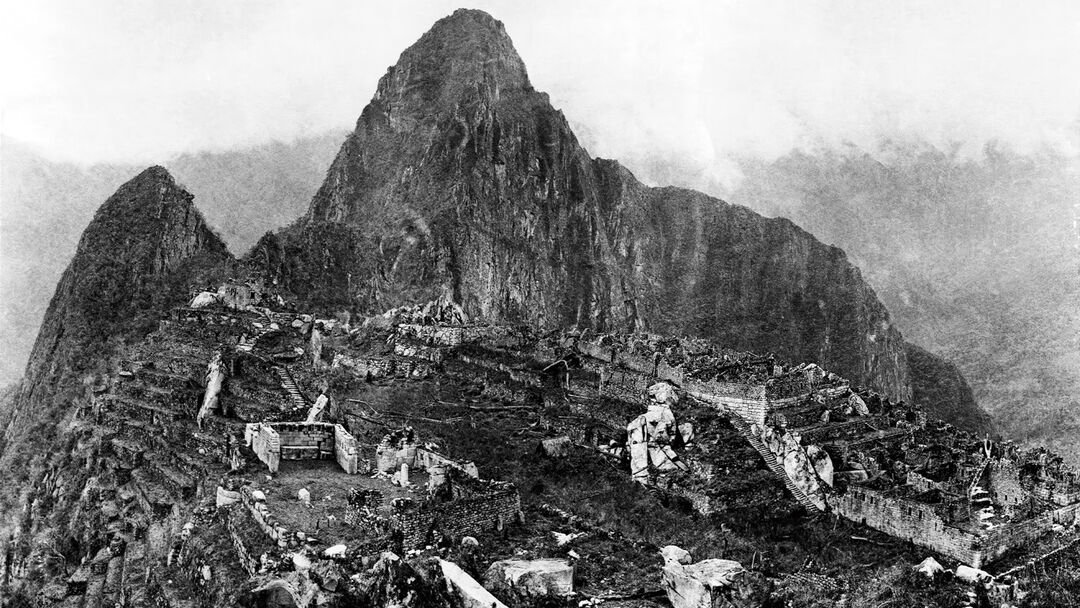 Photograph of Machu Picchu taken by Hiram Bingham III in 1912 after major clearing work had been undertaken. This picture gives a general view of about one-half of the City of Machu Picchu.