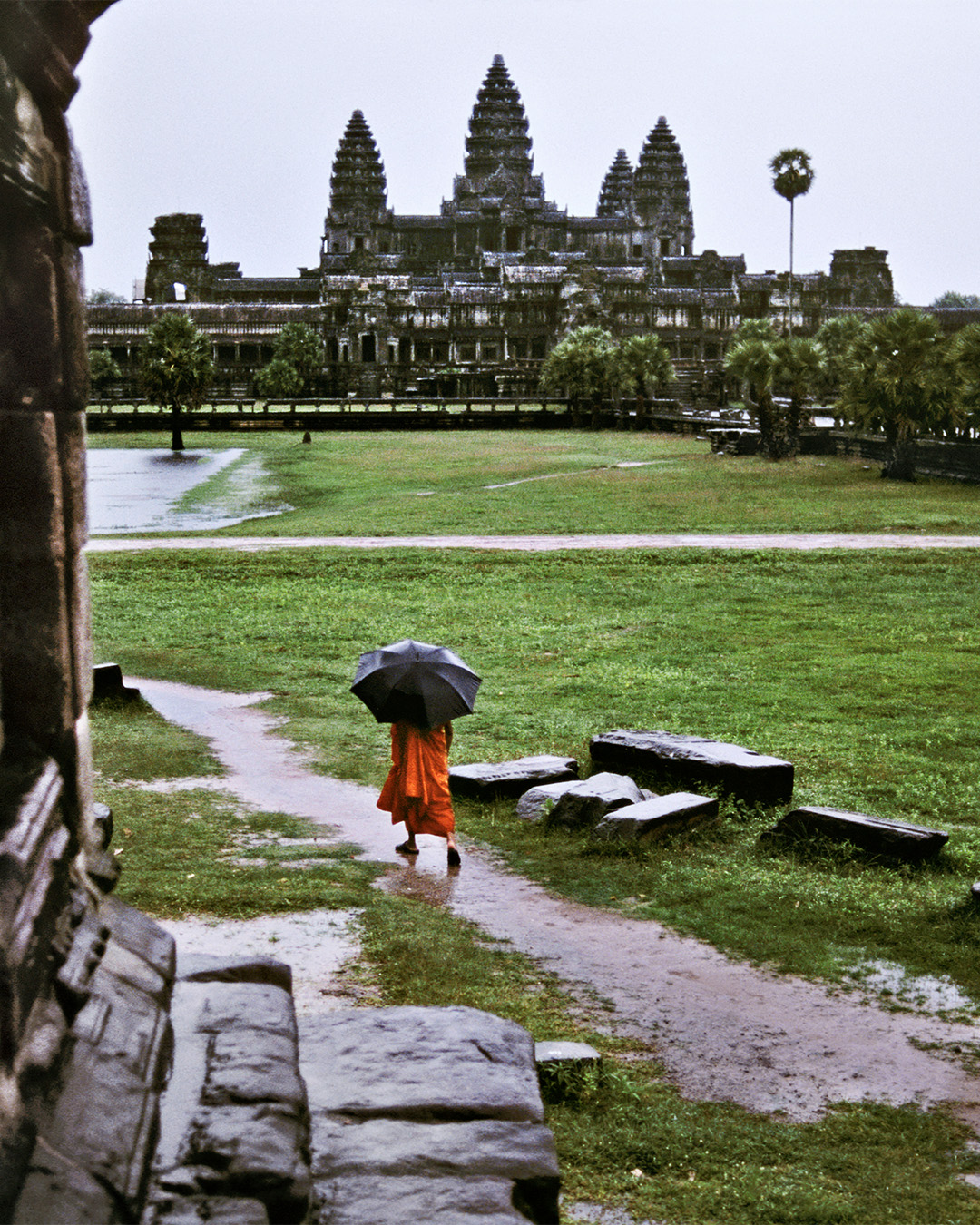 Buddhist Monk Walks in the Rain. Angkor Wat, Cambodia, 1998