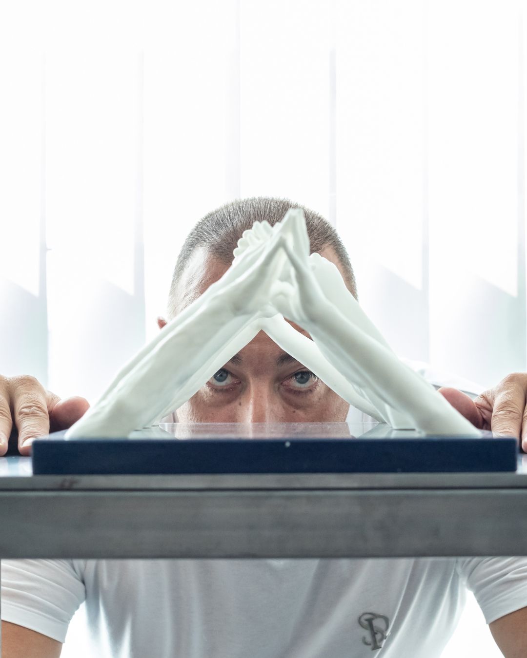 Lorenzo Quinn looking through his art