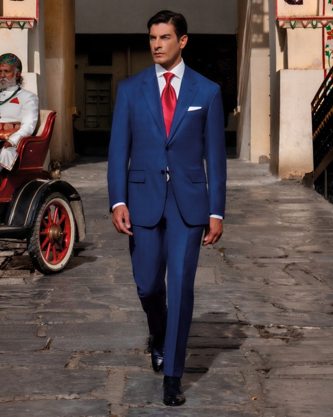Tao wears a timelessly elegant Stefano Ricci Fiesole suit in wool and silk with a cotton shirt and Fatehpur Sikri red silk tie.