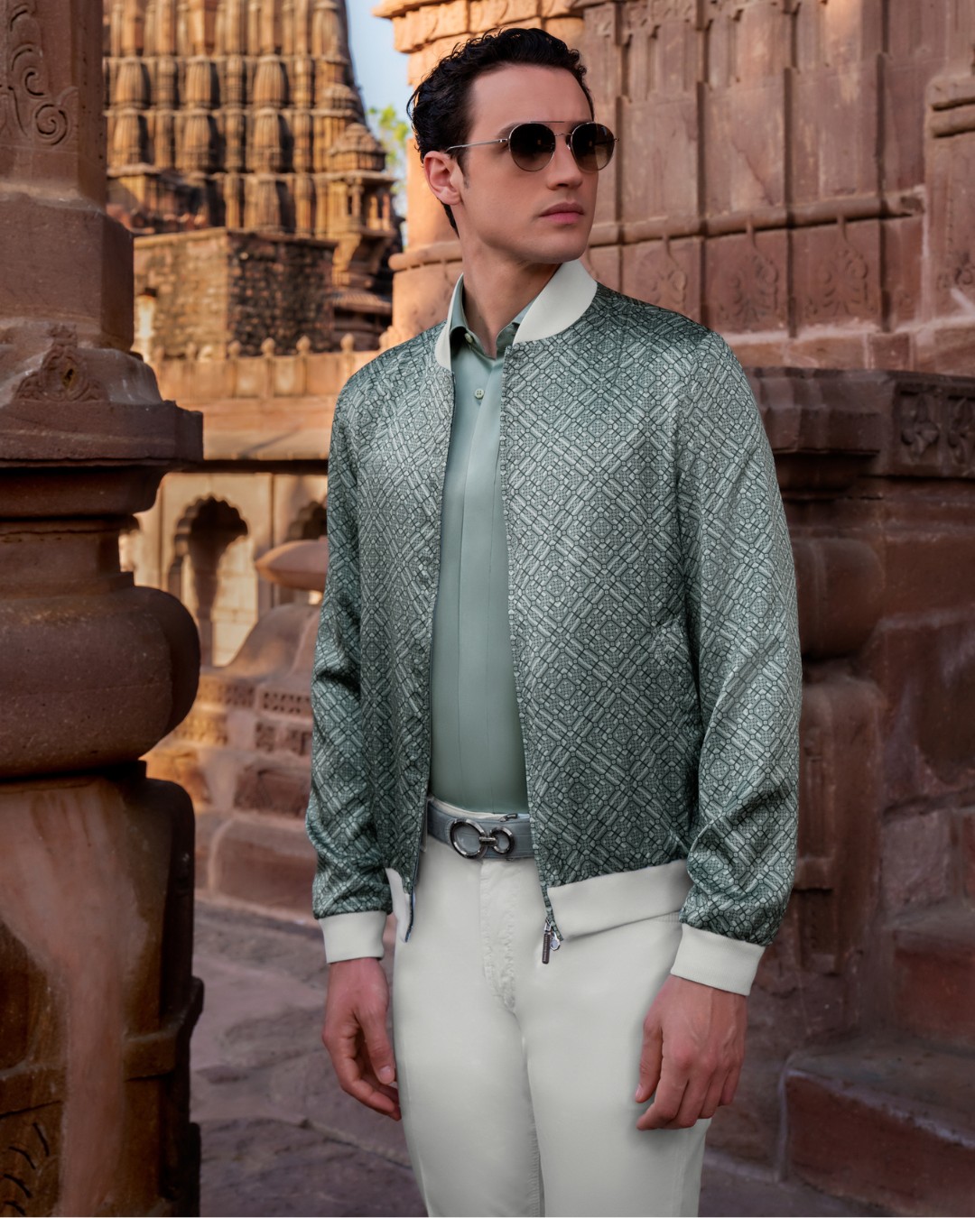 Federico is wearing a silk shirt and a printed silk blouson, inspired by the elegance of the Maharajas.