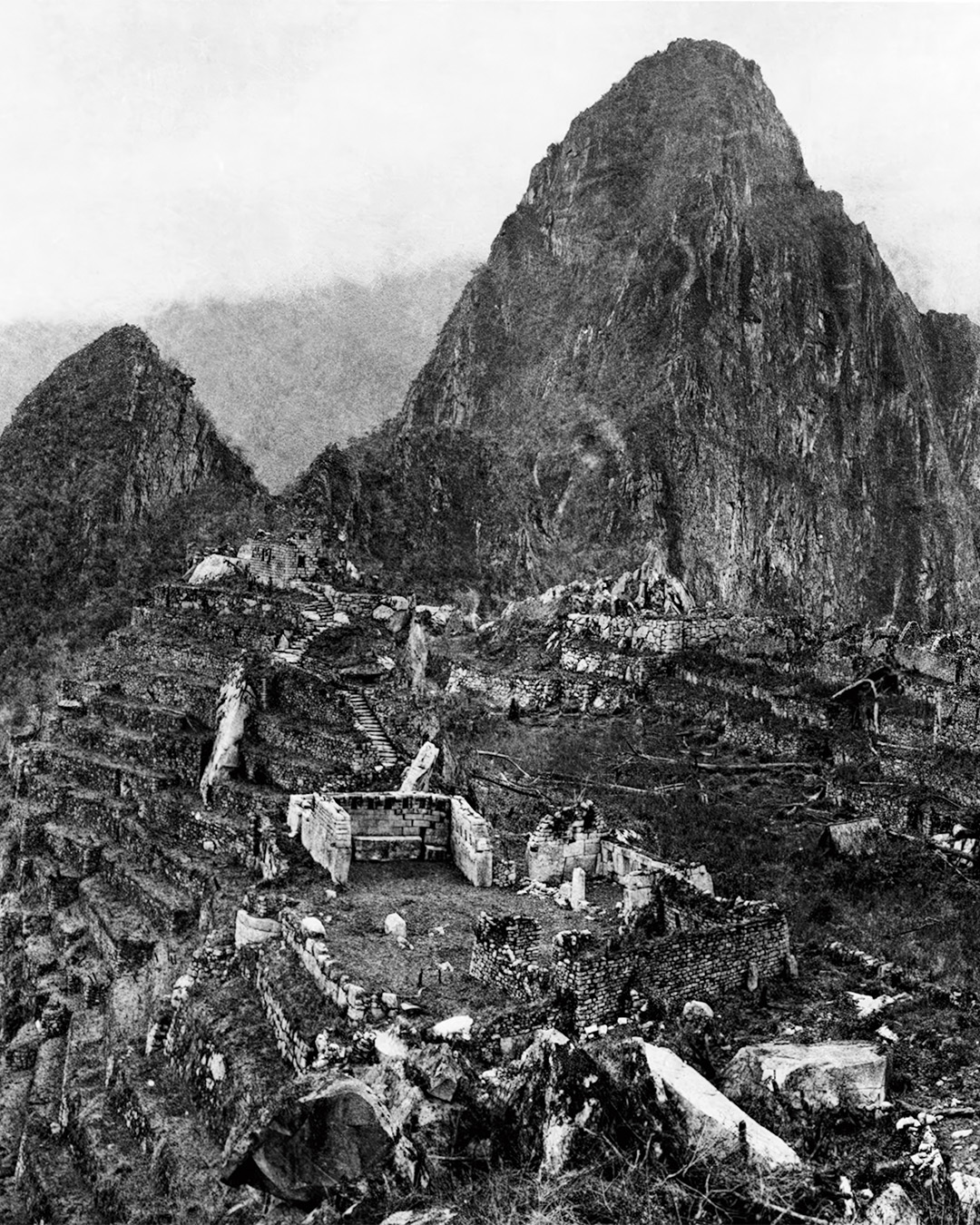 Photograph of Machu Picchu taken by Hiram Bingham III in 1912 after major clearing work had been undertaken. This picture gives a general view of about one-half of the City of Machu Picchu.