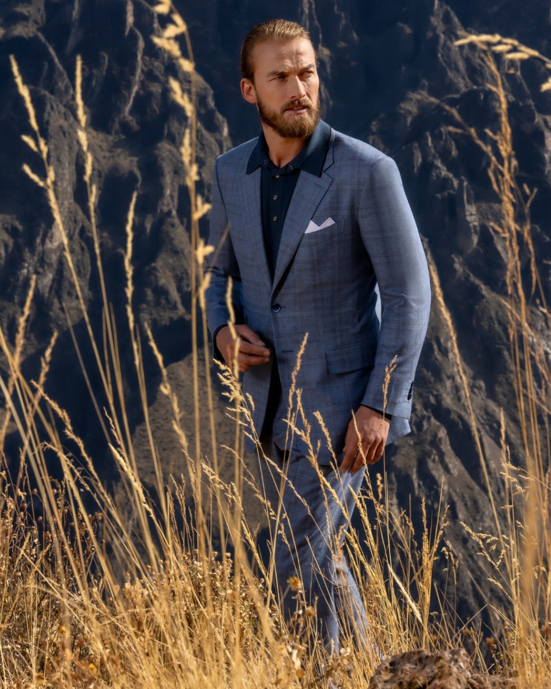 The model wears a two-button suit, wool and cashmere